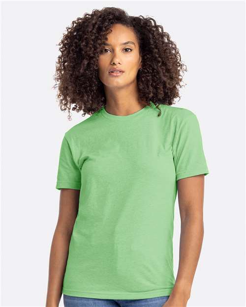 Woman wearing a green Next Level 6210 Unisex CVC T-Shirt, showcasing soft fabric and casual style, relevant to custom apparel offerings by Hau Ink.